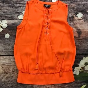 Bebe silk orange top blouse with lace